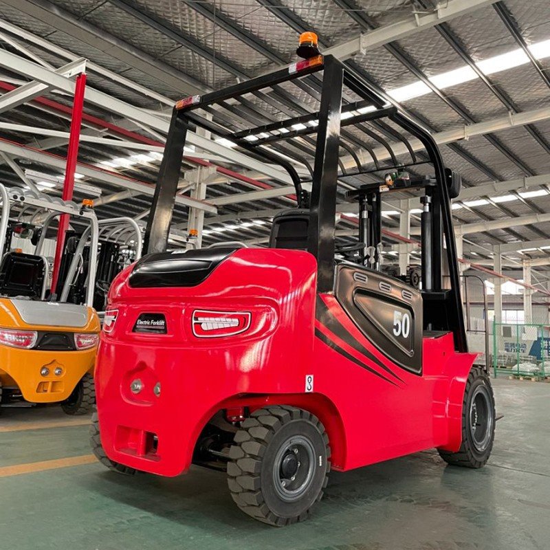 5 ton electric forklift handling heavy machinery components
