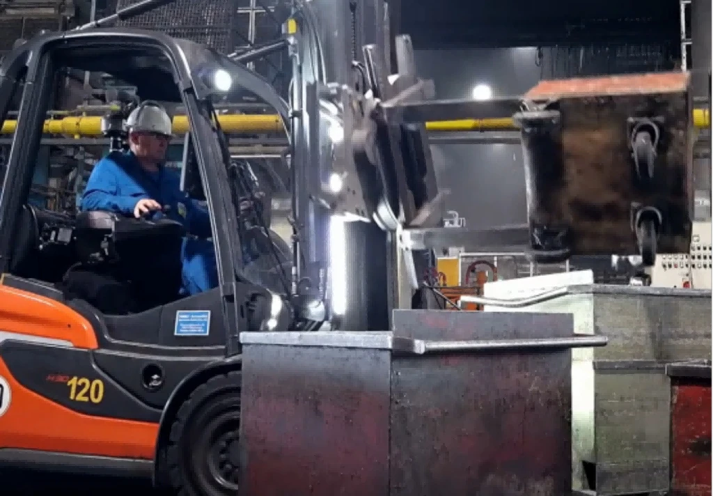 12 ton heavy forklift lifting steel billet inside metal factory1 12 ton heavy forklift lifting steel billet inside metal factory1