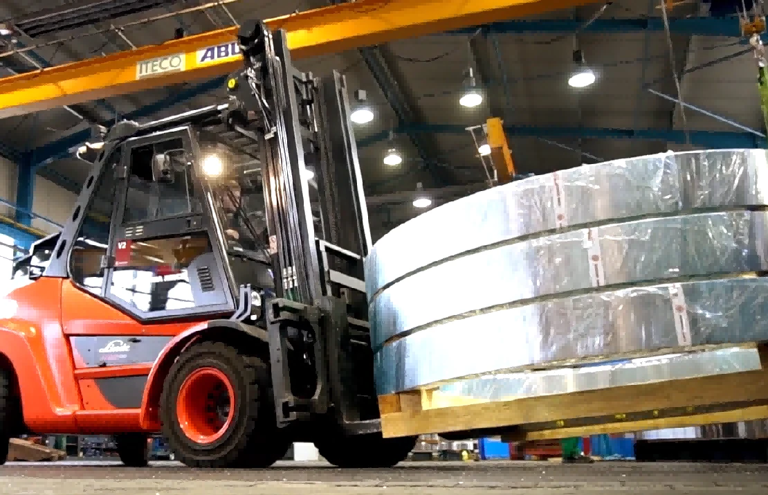 Heavy tonnage forklift with coil attachment transporting steel coil1 Heavy tonnage forklift with coil attachment transporting steel coil1