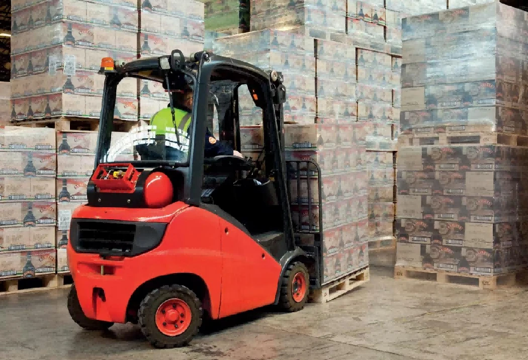 LPG counterbalance forklift operating inside high-volume beverage warehouse1 LPG counterbalance forklift operating inside high-volume beverage warehouse1