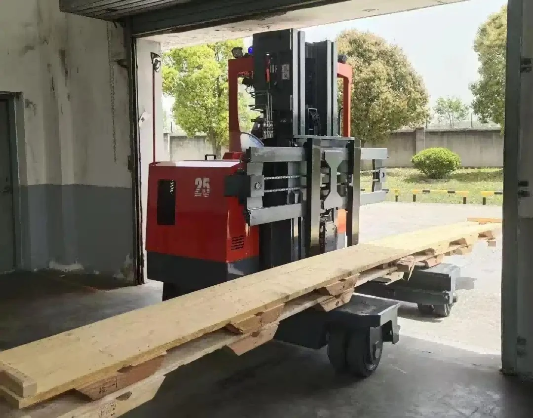 Forklift equipped with longload attachment transporting lengthy timber beam1 Forklift equipped with longload attachment transporting lengthy timber beam1