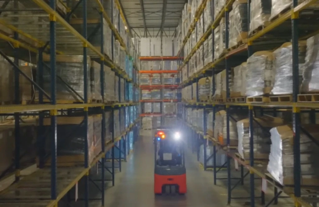 Lithiumion electric forklift operating in large multishift highrack warehouse1 Lithiumion electric forklift operating in large multishift highrack warehouse1