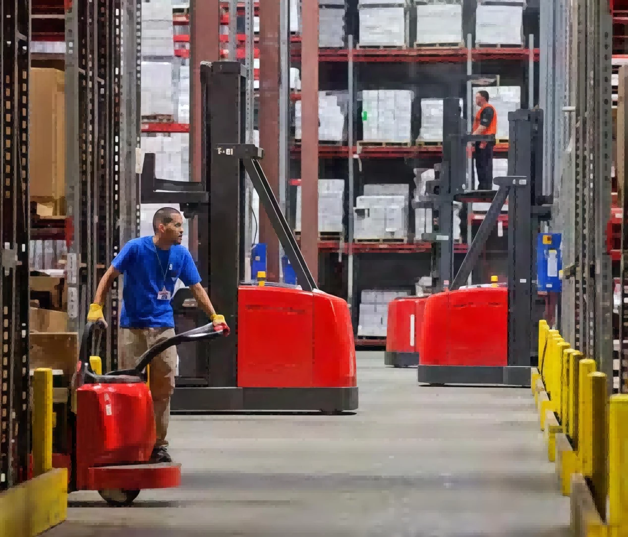 Fleet of different electric materialhandling trucks in highrack logistics warehouse1 Fleet of different electric materialhandling trucks in highrack logistics warehouse1